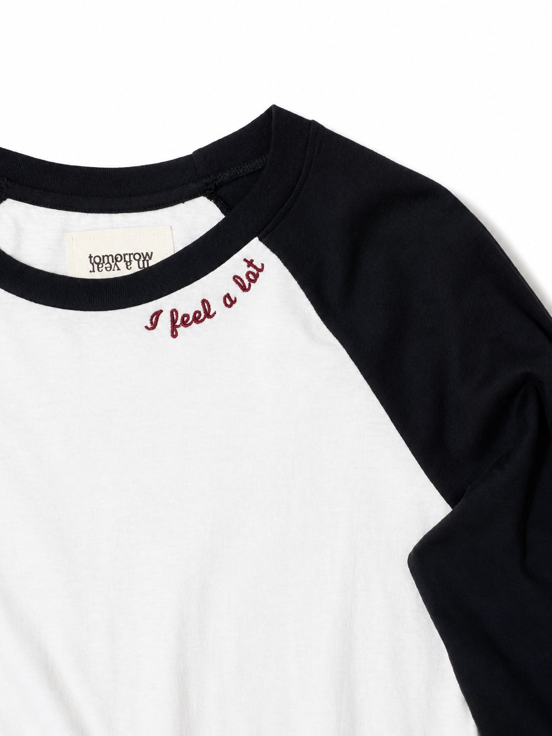 Black and white long-sleeve shirt with 'I feel a lot' text on a white background